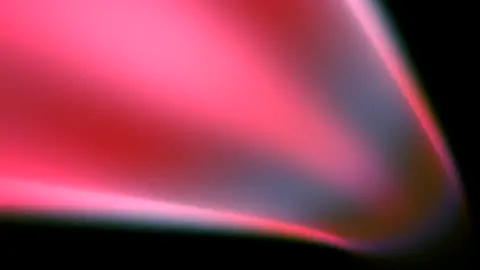 Red particles circling a burning red core.
