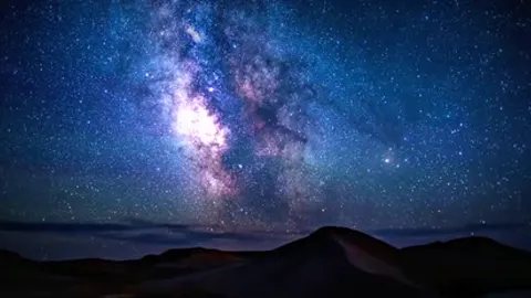 Stars wheeling above an empty desert.