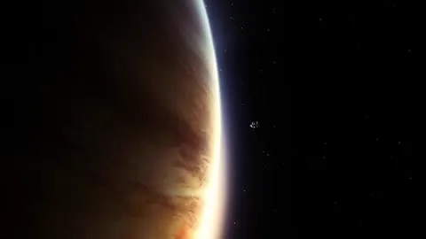 An alien world hanging silent above its moon.